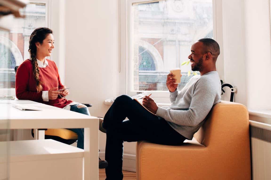 A business meeting between a man and woman.