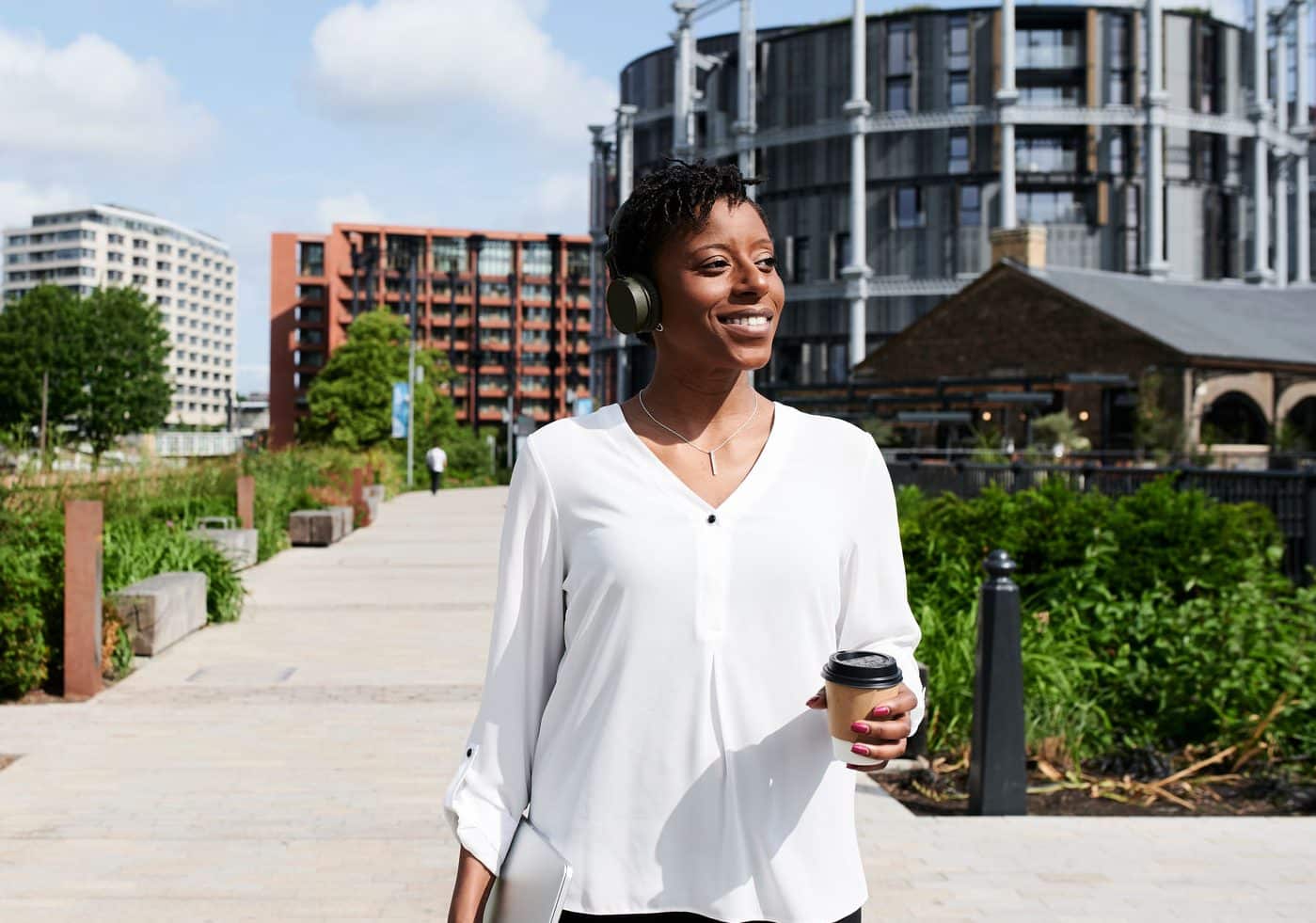 Woman taking a walk and listening to music.