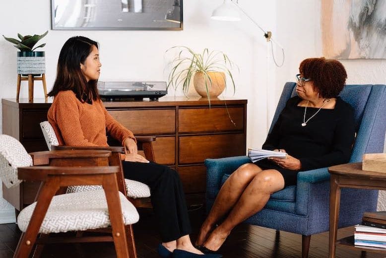 A woman in her therapy session with a female therapist