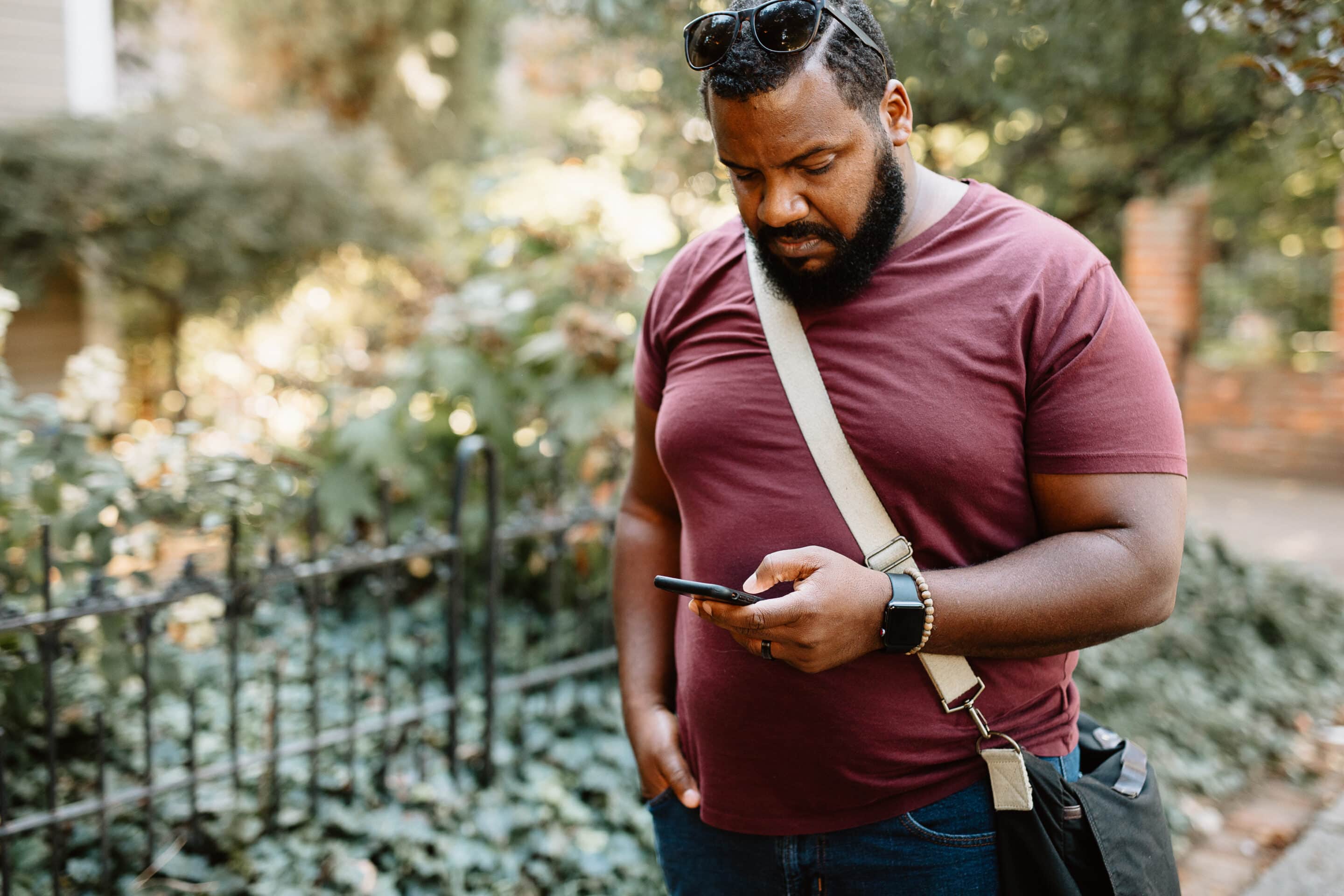 A man outside on his phone.