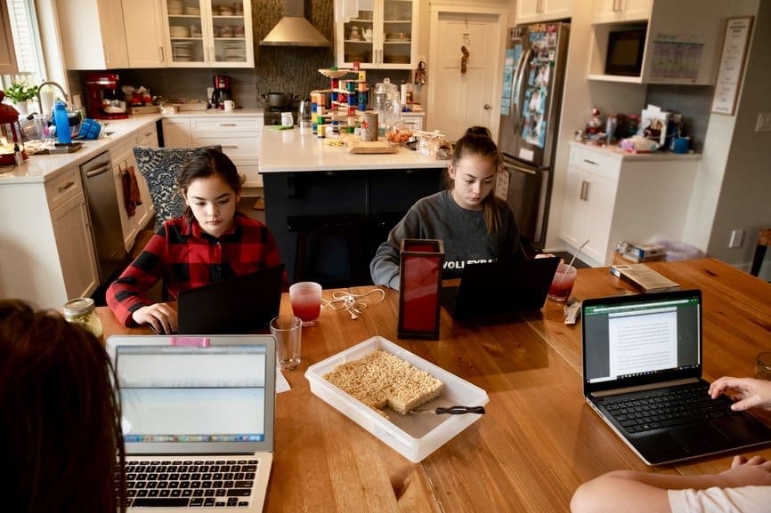 teens working on laptops