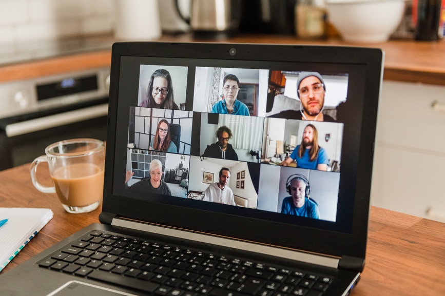 Anonymous woman having a video call with team members