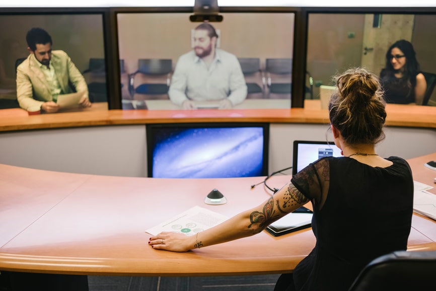 Businesspeople during a meeting through video conference.