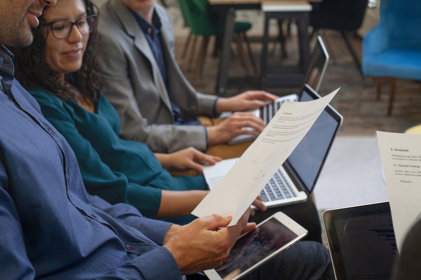 networking, teamwork and collaboration concept, people working with laptop computers and documents