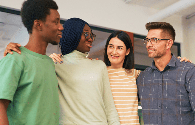 group of people with their arms around each other