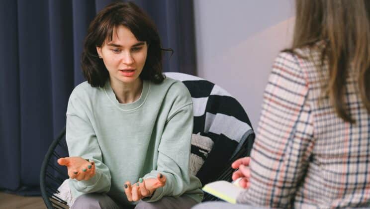 A woman speaking to her in-person therapist.