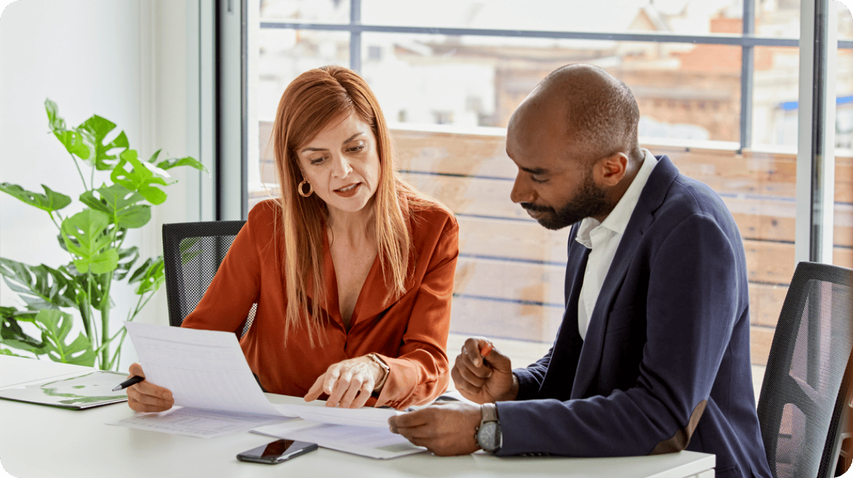 A man and a woman working together in an office