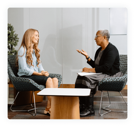 Two women in the middle of an in-person Lyra therapy session.