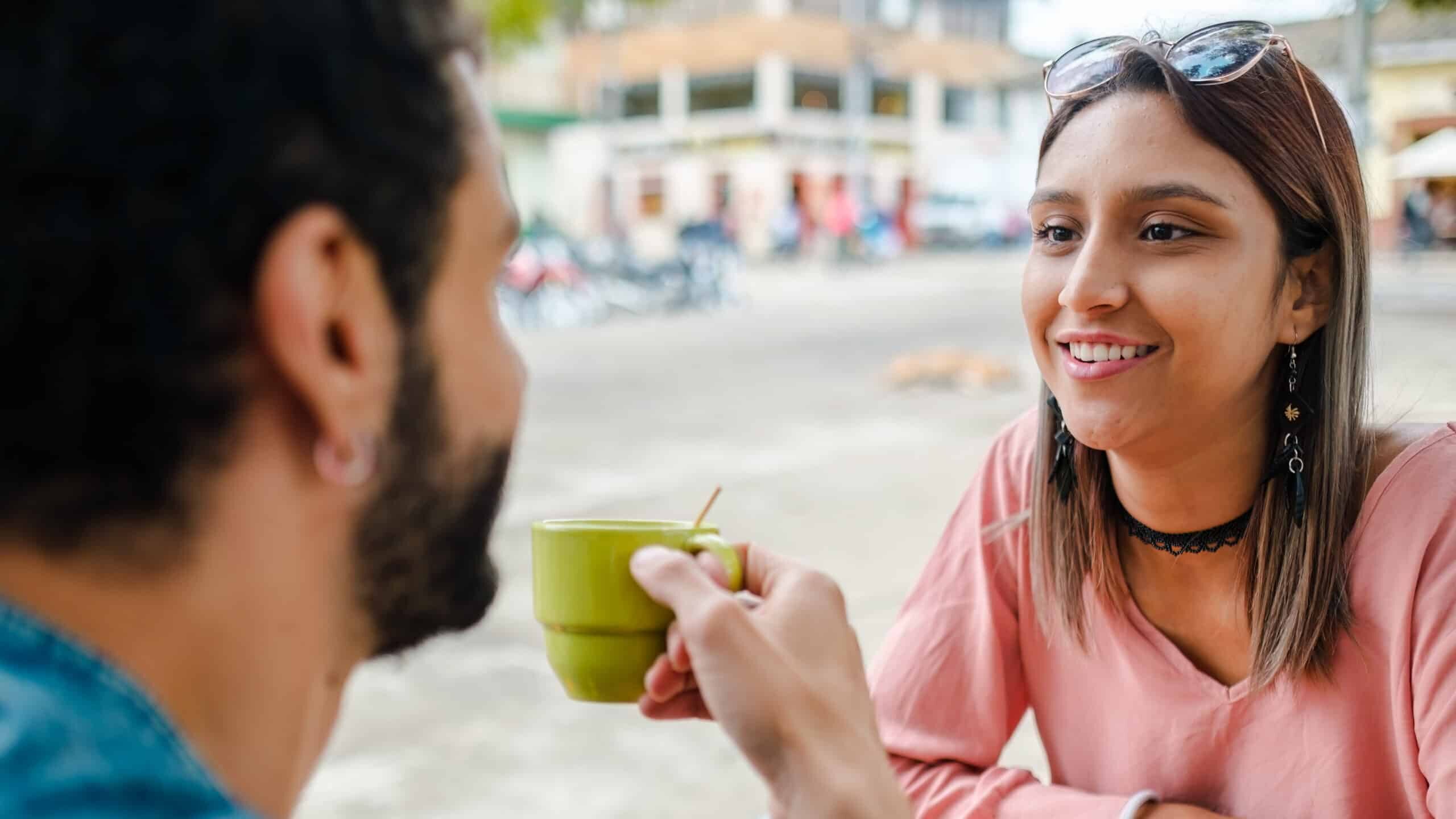 a man and woman drinking coffee together