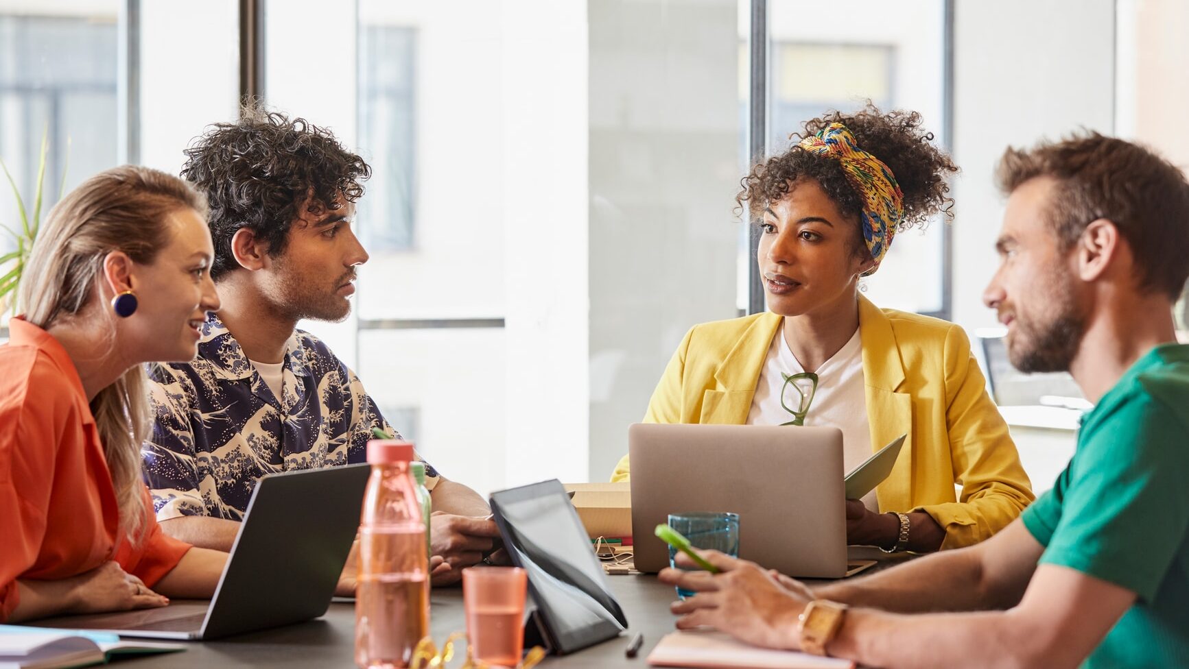 Business debating new ideas by the meeting table