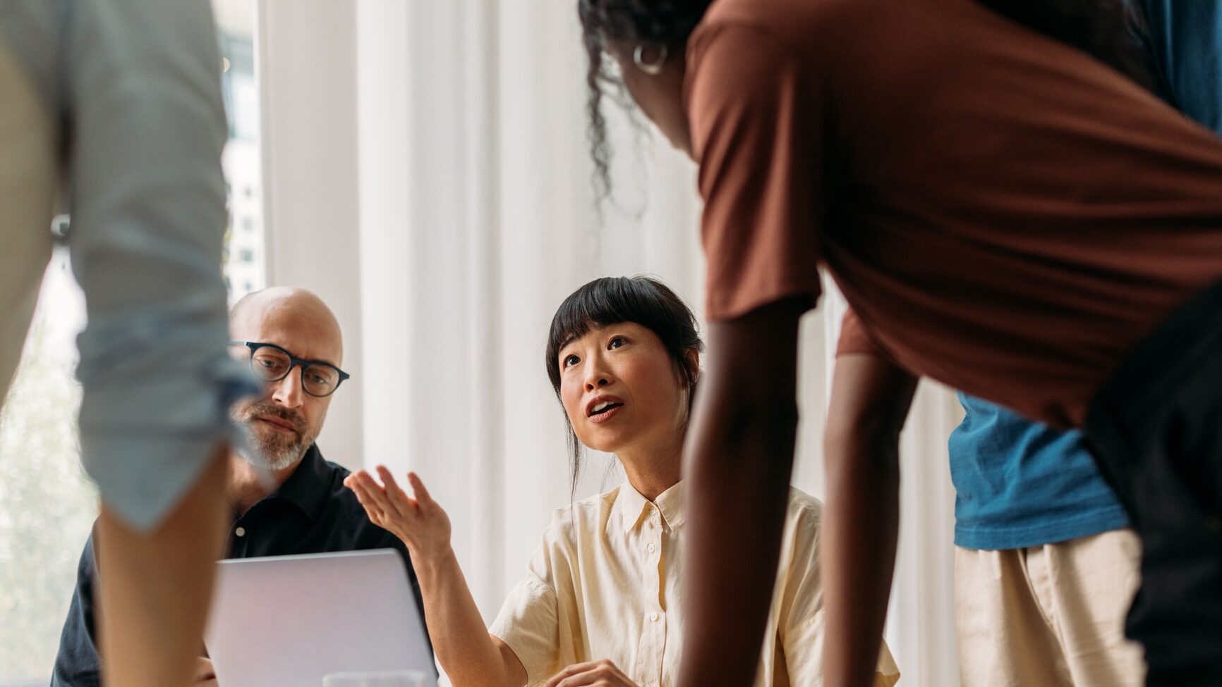 Multiracial colleagues working together in office