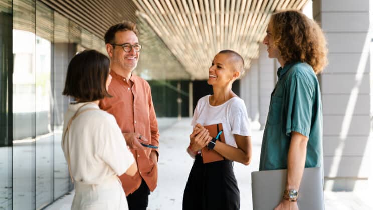 Businesspeople having a conversation on the street
