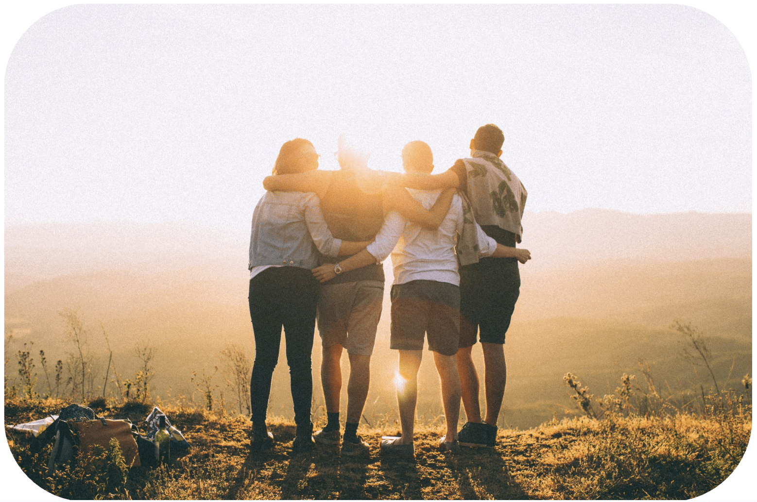 group of people embracing one another