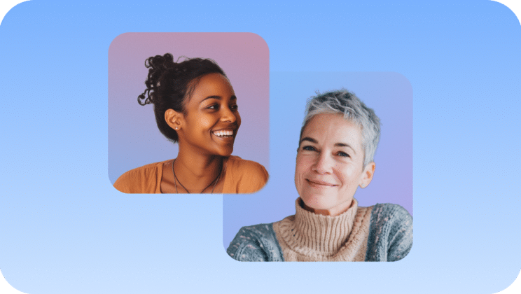 Two women smiling against a gradient blue background. One woman has dark curly hair and wears a brown top; the other has short gray hair and wears a beige turtleneck sweater. Both are facing slightly toward each other.