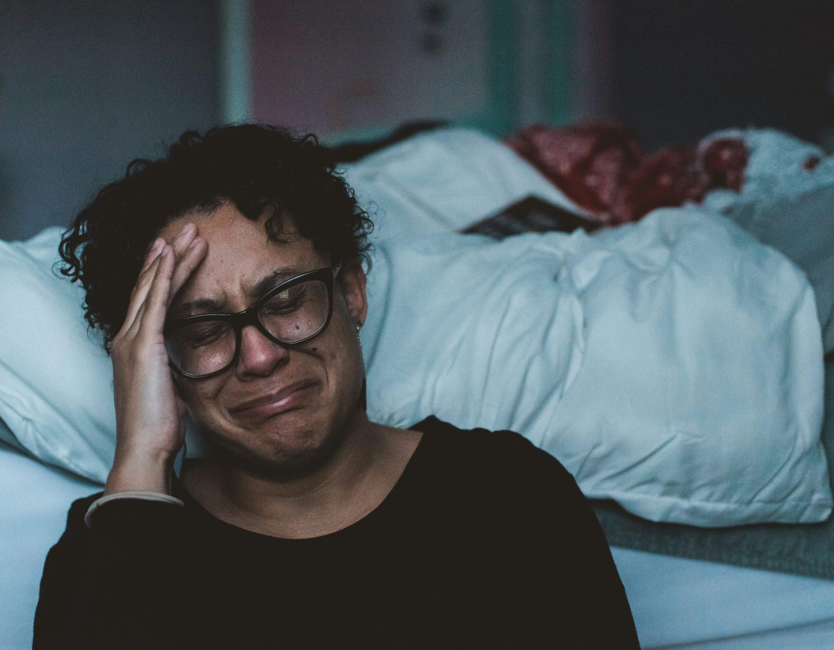 women distressed putting hand to forehead