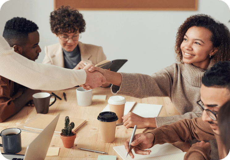 woman shaking someones hand