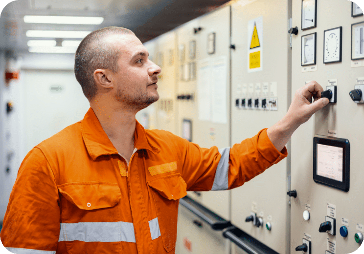 man touching a knob on machine