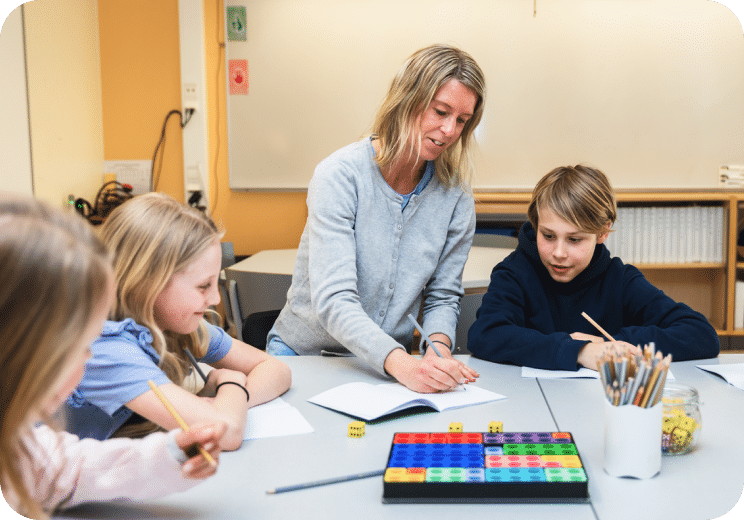 women teaching three children