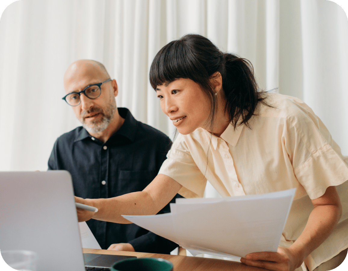 man and woman looking at laptop