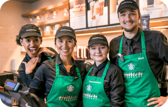 photo of starbucks baristas, three woman and a man