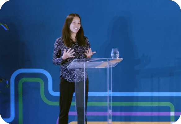 photo of a woman speaker at a podium