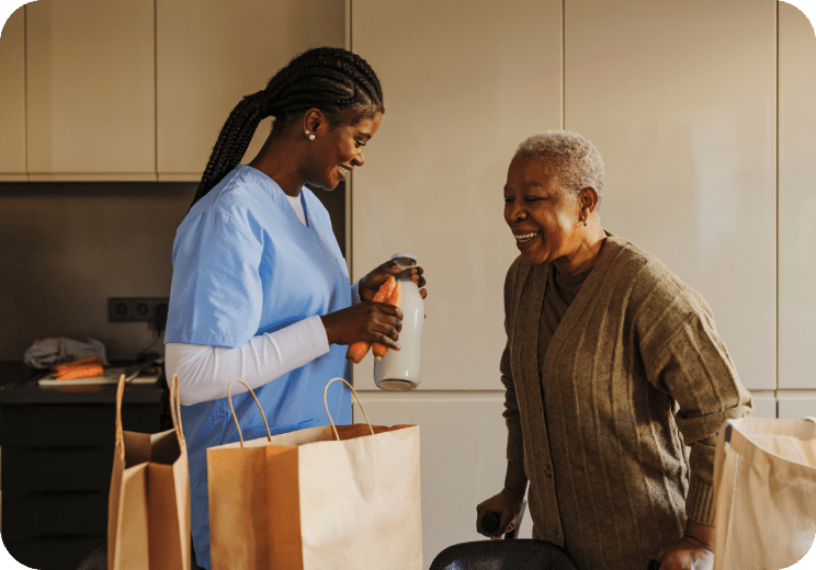 a nurse helping an older woman