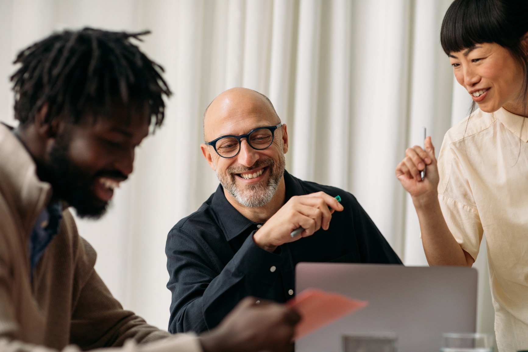 Happy coworkers working in office